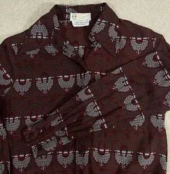 Shirt shows very little actual wear. There are no stains or marks and shirt is in overall excellent condition however...