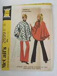 ©1970; Misses and Junior Poncho in Two Versions and Pants. Lined poncho hooks at neck.