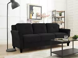 The Lifestyle Solutions Taryn Curved Arms Sofa upholstered in Black Fabric is the three-seat option of this versatile...