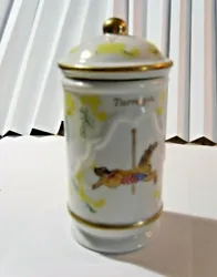 Each spice jar featured a different carousel animal surrounded by decorative sprigs of the spice or herb the jar was...