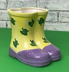 Add a pop of color to any room with this vintage hand-painted ceramic rain boots vase. These yellow frog boots make for...