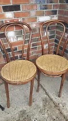 2 very nice vintage Bentwood Thonet style Sweetheart chairs. Caned seats are in very good condition. Wood is good as...