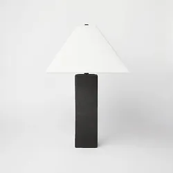 •Black table lamp with white shade •Features a ceramic base •1-way (on/off) light setting •Designed with lamp...