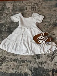 Girls white shift crepe-like material dress. Shirt sleeved, small embroidered polka dot detail with white slip...