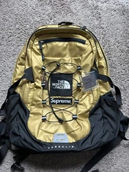 Supreme x The North Face Borealis Metallic Gold Backpack Used. Backpack is in fantastic condition and comes with 2...
