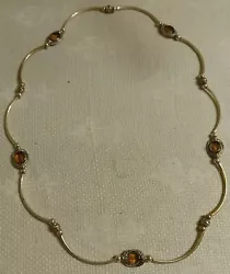 This necklace is nifty. It is not hallmarked. It is in good condition with no missing pieces. We are in no way experts...