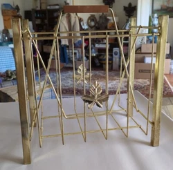 Vintage Mid Century Metal Magazine Rack w/ Wood Handle Gold Wire & Leaf Tone. This piece is very pretty and is in very...