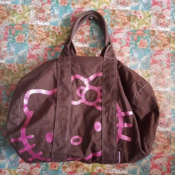This rare Y2K vintage Hello Kitty duffle bag by Sanrio is a must-have for any fan of the iconic character. The bag...