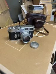 5cm Summicron 1:2 Lens. Leica M-3 Double stroke silver body w/. includes Cap for lens and Leather Case seen. Physically...