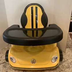 2015 toys r us volkswagon car design booster seat. Yellow and black. Removeable tray.Safety straps. Very good condition
