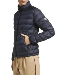Ultra warm and luxurious “Octavien” down jacket from Moncler! In pristine condition, this jacket has a concealed...