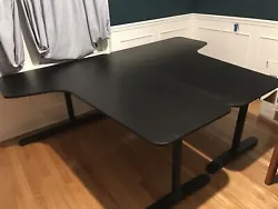 A Pair of IKEA Bekant Office Desks in Black. We have a matched pair of nice large gently used IKEA corner Bekant desks...