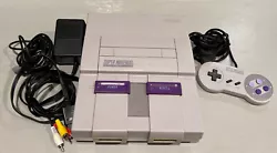 Super Nintendo SNES System Console with Controller. Fully working. Tested and cleaned. Shows some wear on the outside....