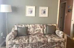 Floral pattern Queen size sofa bed in green, mauve and beige. Might want to replace mattress.