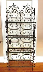 Made from steel and what I believe to be stainless steel on all rounded shelving and scroll work. (majority of rack)....