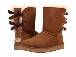 Leather heel label with embossed UGG® logo. Treadlite by UGG™ outsole for comfort. Style :Bailey Bow II. Fixed satin...