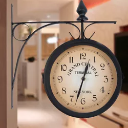 1 x Double sided wall clock (batteries not included). This beautiful clock with a scrolled wall mount topped by a fleur...