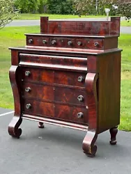 Antique Flame Mahogany American Empire Four Drawer Chest with Glove Box c. 1840 having highly figured book matched...