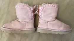 Ugg boots pink bow back 8 toddler girls play condition. Significant discoloration - play condition