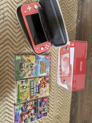 Nintendo Switch Lite 32 Go Console - Corail (HDHSPAZAA) Avec Trois Jeux. ( Mario kart, Mario bros et animal crossing)