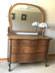 Antique Tiger Oak Serpentine 4 drawer Dresser with Mirror.   This early 1900 dresser is in excellent condition, with...