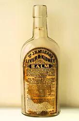 Dating between 1870-1890, this oval bottle is clear in color and stands 8-3/4
