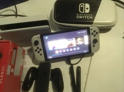nintendo switch oled 64 GB ) + 5 Jeux + accessoire.
