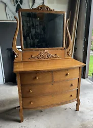 Antique Oak 4 Drawer Bowed Front Dresser With Beveled Mirror Beautiful Grain!. Condition is Used. Local pickup only.
