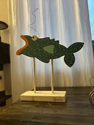This unique sculpture is perfect for adding a touch of retro charm to any kids room decor. The colorful Fish On A Stick...