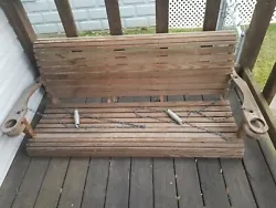 Wooden Porch Swing Amish Made.  Has cup holders on each side. Very relaxing  In great shape. Local pickup only. See...
