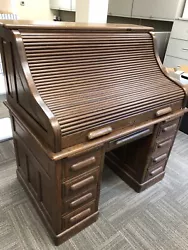 Antique Oak Roll-top Desk Local pickup only. 47 inches wide, 31 inches deep and 51 inches tall. In beautiful condition....