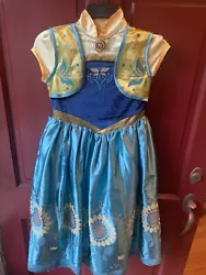 The beautifully designed dress features the iconic blue color worn by Princess Anna and is sure to make any little girl...