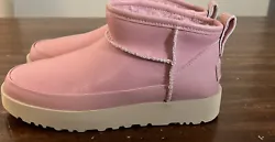 Step up your shoe game with these authentic UGG Classic Ultra Mini Leather boots in Shell Pink. The boots are made of...