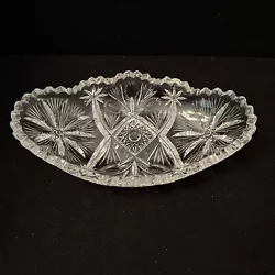 Beautiful bowl with very unusual star/flower cuts on each end and almost a thistle or pineapple pattern in the middle....
