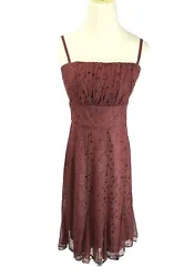 Coast Strapless Dress. Color is of a Rust/ Burnt Red. Floral pattern Embroidery with Eyelet accent. Tulle fabric as...