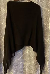 This is V shape BLACK poncho. It has fringe and slips over the head. Size XL. 