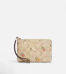 Coach Corner Zip Wristlet In Signature Canvas With Nostalgic Ditsy Print NWT. Signature coated canvas and smooth...