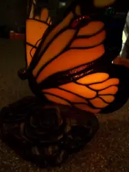 Brass base with flower motif, this Monarch butterfly lamp lends a warm glow to your entry table or desk!  Roll switch...