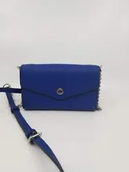 Material: Saffiano PVC Leather. Color: Sapphire Blue. Exterior Slip pocket. Interior Zip Pocket & Cell Phone...