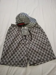 Gucci shorts and hat. Gray with black Gucci monogram. Must haves!.