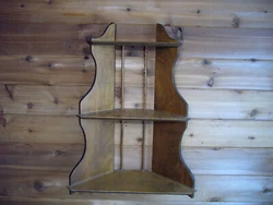 Good Used Condition. Very Cool looking Wall Shelf can be put in corner but will look great on any wall. Three shelves....