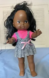 She is approximately 12 inches tall. She has long black hair. She does have some minor scratches comes with her clothes...