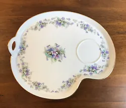 Lovely porcelain snack tray displaying blue and purple violets, and accented with gold trim.
