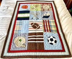 This is a wonderful pre-owned Pottery Barn baby boy crib quilt. Features sports like baseball, soccer, football,...