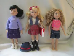 These dolls are really cute. You get the Brunette with Brown Eyes wearing a purple shirt, purple skirt and sneakers....