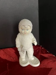 This vintage Snowbabies figurine depicts a heartwarming scene of a snowbaby making a special delivery on snow shoes,...