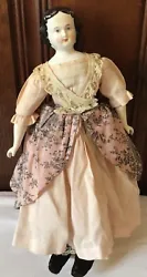 Antique China Head Doll Porcelain Doll 1860’s 14 IN. There is a very fine hairline crack on the shoulder. There is...