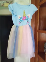 This is a girls dress in size 5-6, sleeveless, light blue top section with unicorn and floral designs. Pink slip with6...