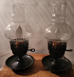 Vintage oil lamp style lights. Plug in.. one cord has been fixed at some point they work great.