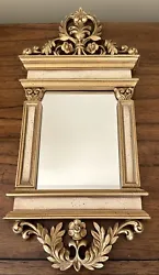 This beautiful Syroco mirror measures approximately 17.25” from top to bottom and 8” across the top at the longest...